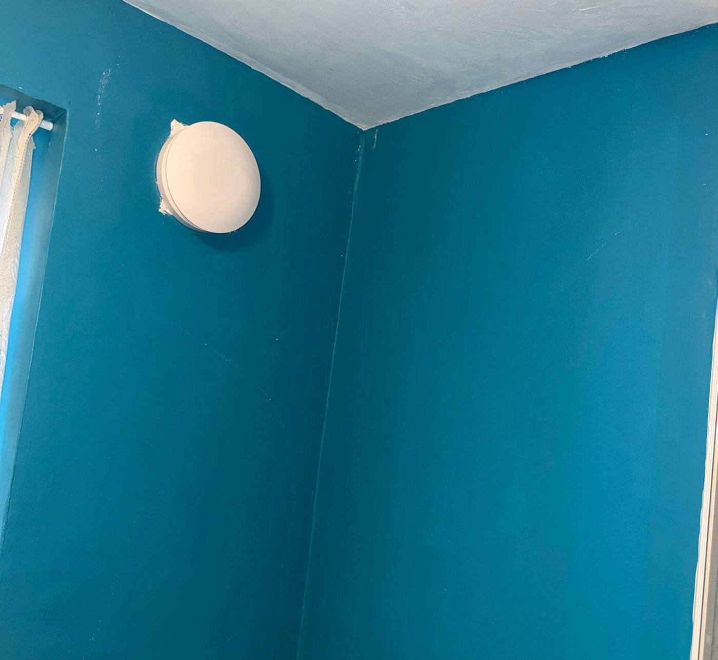 New bathroom extractor fan installed and wired by Dixon Electrical, fitted flush to the wall with the ducting sealed